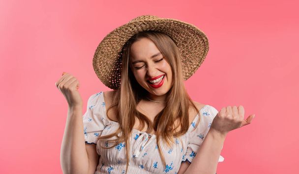 Pretty woman shows triumph yes gesture of victory, she achieved result, goals. Girl glad, happy, surprised excited happy lady on pink background. Jackpot concept. High quality - Photo, Image