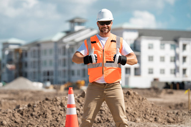 Hispanic 40s worker builder man on site construction. American middle aged man worker. Millennial construction worker with at building. Portrait of builder worker man small business owner - Foto, Bild