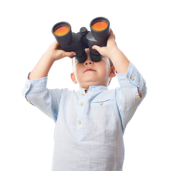 Boy looking through the binoculars - Photo, Image