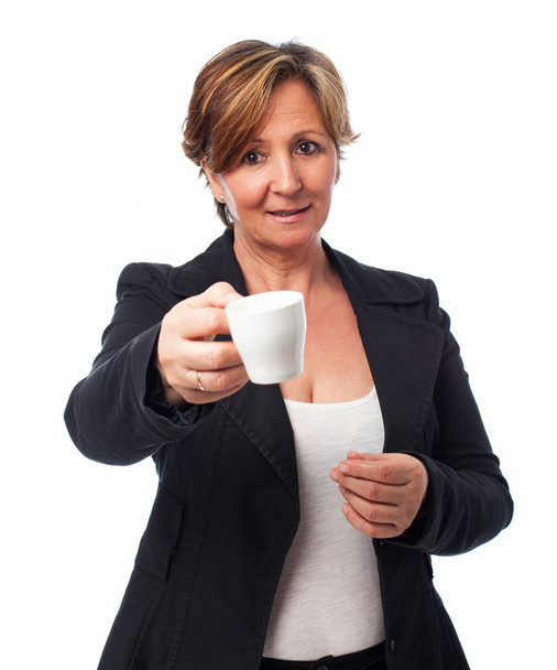 Woman offering a coffee cup - Foto, afbeelding