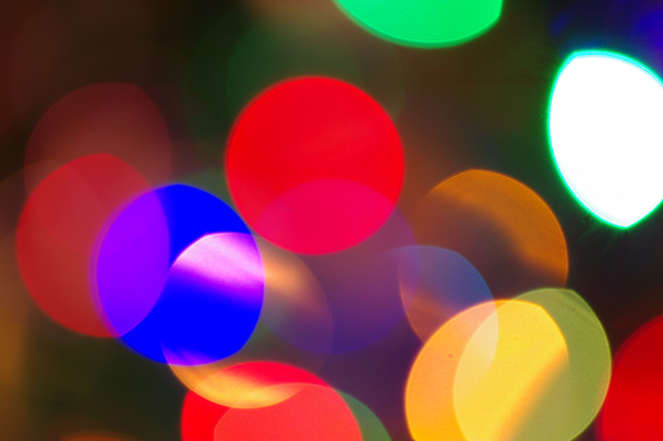 Colourful festive multi-colored circles . Defocused abstract multicolored bokeh lights background - Foto, imagen