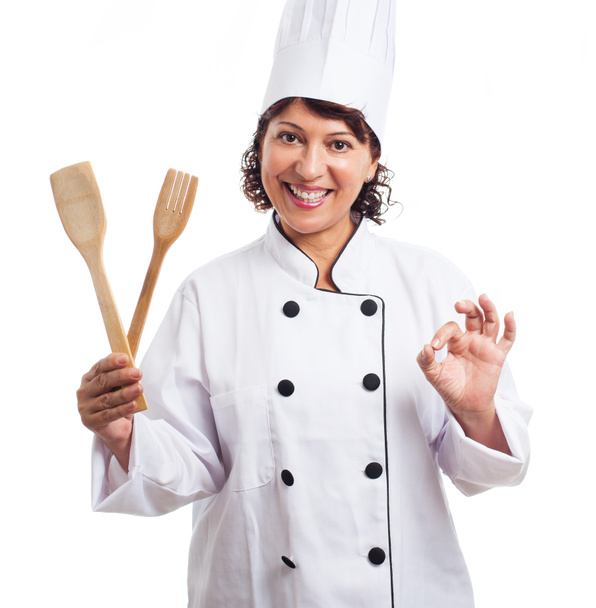 Femme tenant cuillère et fourchette
 - Photo, image