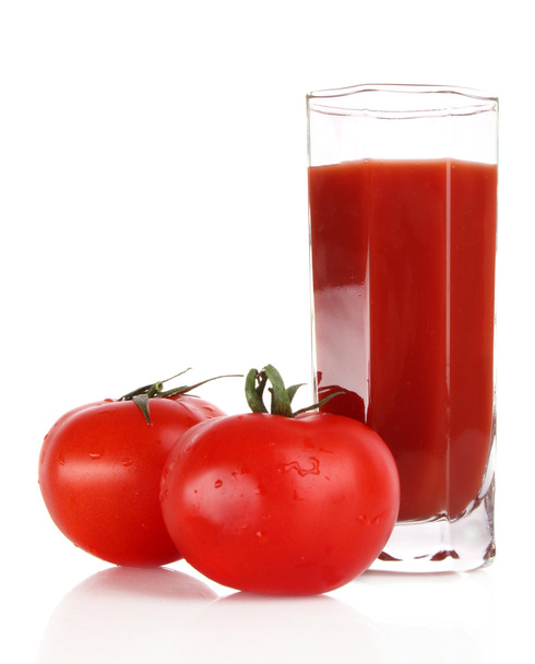Glass of fresh tomato juice and tomatoes round the glass on th - Foto, imagen