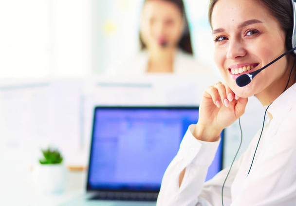 Smiling businesswoman or helpline operator with headset and computer at office. - Φωτογραφία, εικόνα