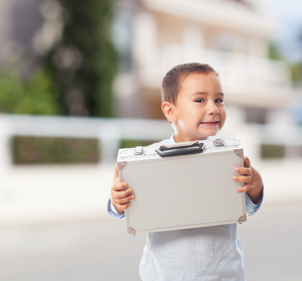Boy holding a briefcase - Фото, зображення