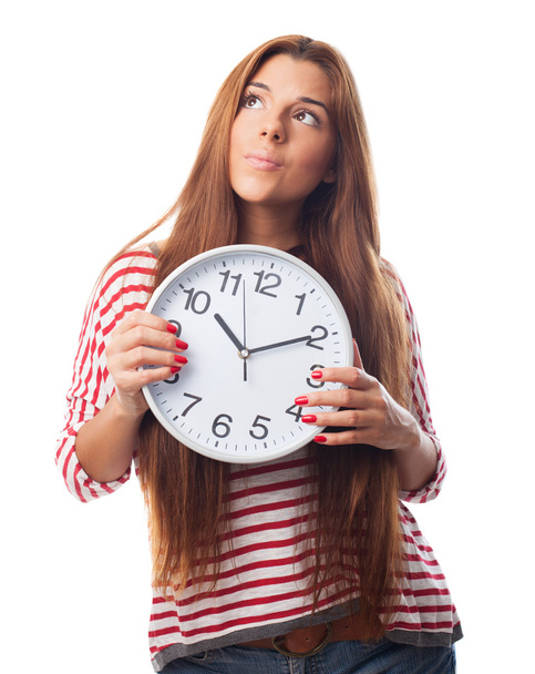 Woman holding a clock - Фото, изображение