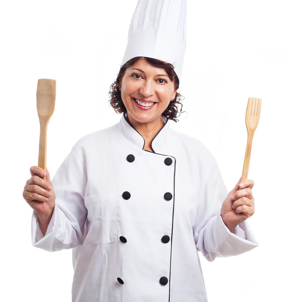 Mujer sosteniendo cuchara y tenedor
 - Foto, imagen