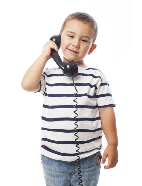Kis fiú beszélt telefonon - Fotó, kép