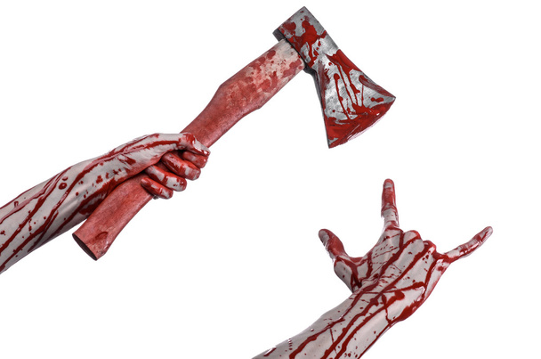 Bloody Halloween theme: bloody hand holding a bloody butcher's ax isolated on white background in studio - Valokuva, kuva