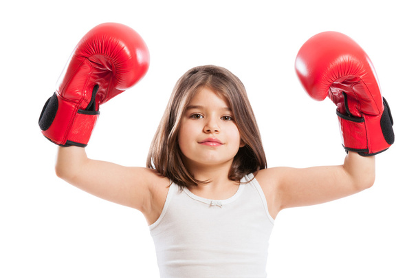 Young boxer girl raising arms up - Foto, afbeelding