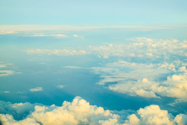 above view of fluffy sky clouds, atmosphere background - Photo, Image