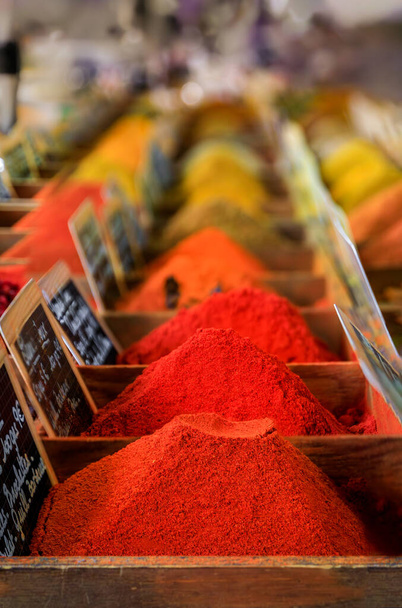 Bulk spices, curry, saffron, garam masala and paprika at a local provencal farmers market hall in the old town or Vieil Antibes, South of France - Photo, Image