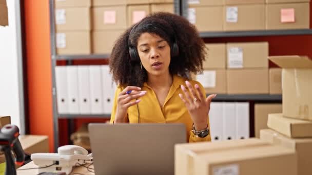 African american woman ecommerce business worker having video call at office - Filmmaterial, Video