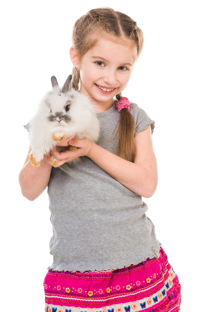 little girl with a rabbit  - Фото, изображение