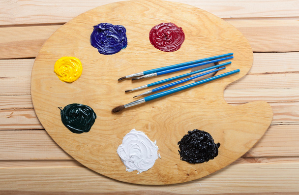 Palette with oil paint and brushes. - Photo, Image