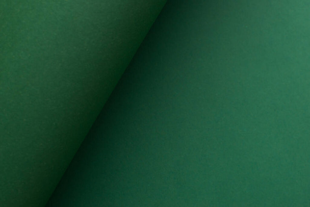 Curved diagonally divided 3d green background - Foto, afbeelding