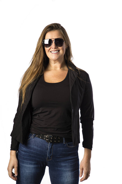 Forty year old woman, wearing sunglasses and a sport jacket, isolated on a white background - Foto, afbeelding