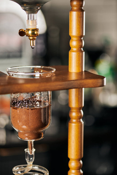 cold brew coffee maker, cold water dripping on fresh ground coffee, alternative espresso brewing - Photo, Image