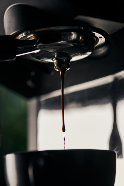 coffee extraction, drops, hot beverage, espresso dripping into cup,  professional coffee machine  - Photo, Image