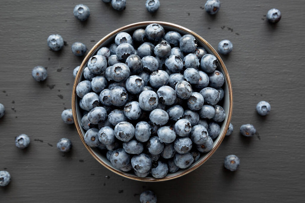 Organic Blueberries in a Bowl, top view. Flat lay, overhead, from above.  - Photo, Image