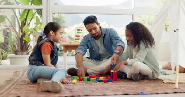 Home, father and girls with building blocks, smile and quality time with love, bonding and learning. Family, happy dad or female children with male parent, kids or fun with toys and child development. - Video
