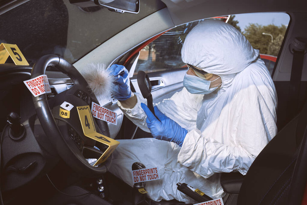 Crime scene investigation - finding and developing of fingerprints in car - Foto, Bild