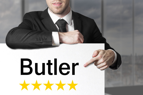 businessman pointing on sign butler five stars - Foto, Imagem