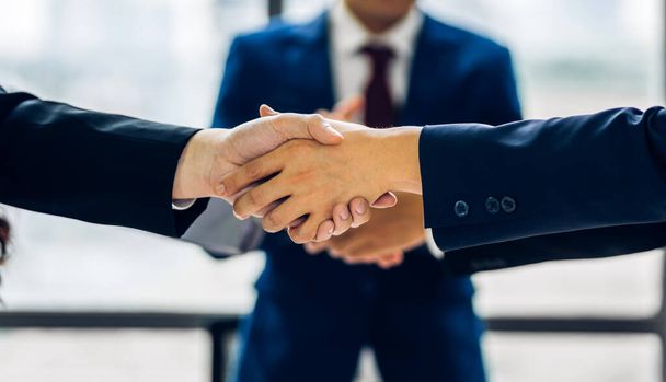 Image two business partner meeting successful handshake together with success join congratulation good deal contract in modern office.Partnership approval and teamwork concept - Photo, Image