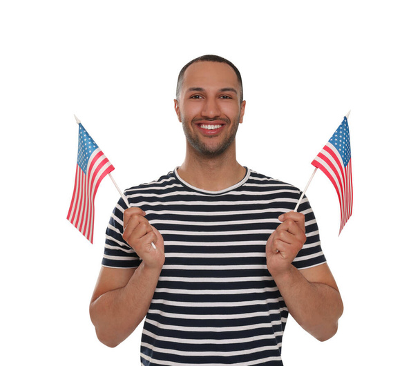 4th of July - Independence Day of USA. Happy man with American flags on white background - Fotografie, Obrázek