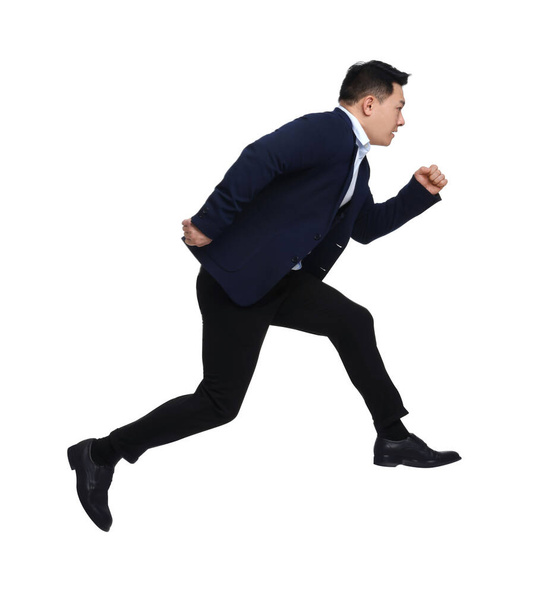 Businessman in suit running on white background - Foto, imagen