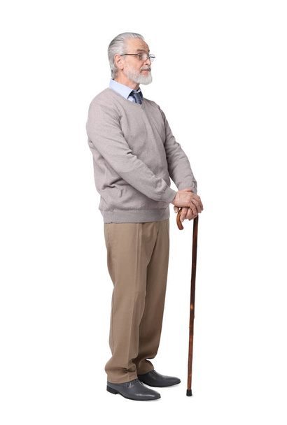Senior man with walking cane on white background - Φωτογραφία, εικόνα