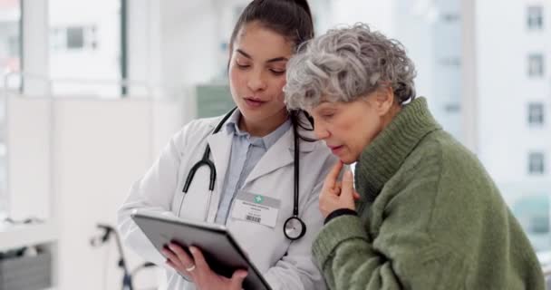Results, tablet or doctor with senior patient in consultation for healthcare advice or checkup at hospital. News, online or medical worker talking to elderly woman in meeting appointment for medicare. - Materiaali, video