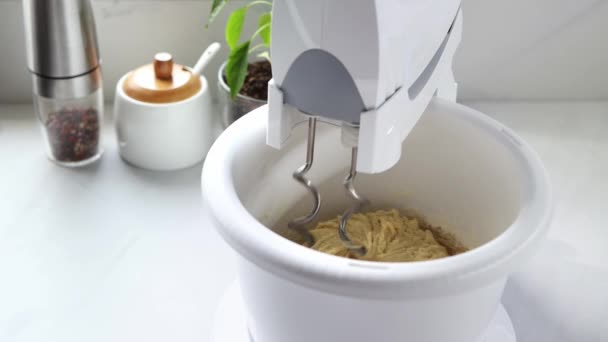Mixer stirs the dough in a spinning bowl. A stationary mixer with a bowl kneads the dough. High quality 4k footage. - Footage, Video