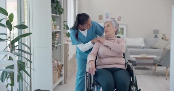 Caregiver, elderly woman and talking about wheelchair support discussion, geriatric senior care or old age disability. Nursing home conversation, disabled person and nurse chat to retirement patient. - Materiał filmowy, wideo