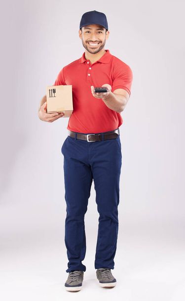 Asian man, portrait and box with pos for payment, delivery or ecommerce against a grey studio background. Male person smile in supply chain, logistics or courier service with package and card machine. - Fotografie, Obrázek