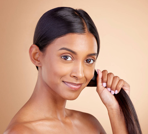Strong hair, portrait or happy woman with beauty, skincare or self care for glow, shine or collagen in shampoo. Healthy texture, model or Indian girl smiling with cosmetics for treatment or grooming. - Fotoğraf, Görsel