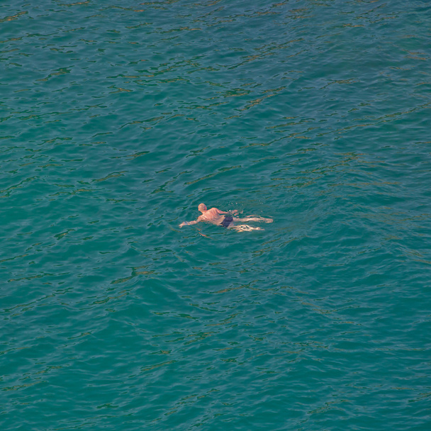 Man swimming in the sea. - Fotoğraf, Görsel
