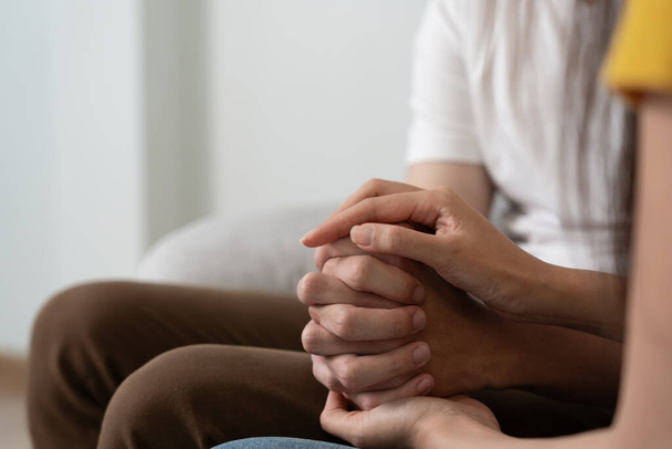 Couple hold hand support each while discussing family issues with psychiatrist. Husband encourages and empathy wife suffers depression. psychological, save divorce, Hand in hand together, trust, care - Фото, зображення