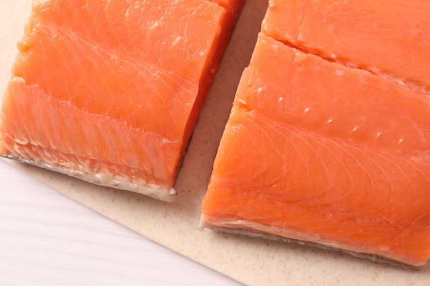 fresh raw salmon on wooden board - 写真・画像