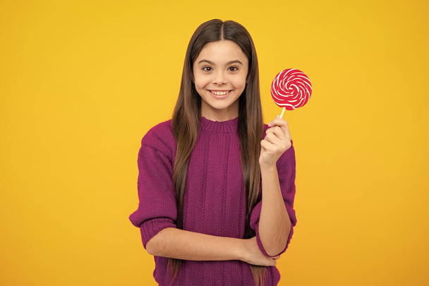 Teenager girl with caramel candies on sticks, sweet sugar addiction. Child with lollipops - Φωτογραφία, εικόνα