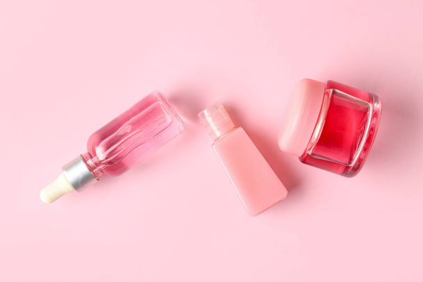 Set of cosmetic products on pink background - 写真・画像