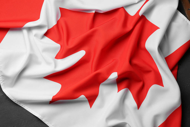 Flag of Canada on black wooden background - Photo, image
