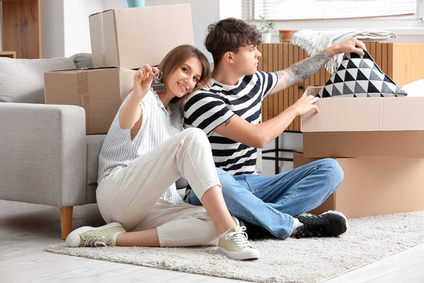 Young couple with keys in their new flat - Foto, Imagem