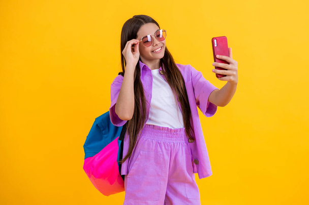 selfie time for school girl. teen blogger with phone. girl making selfie. teen girl make selfie at school. school blog. child streaming online. - 写真・画像