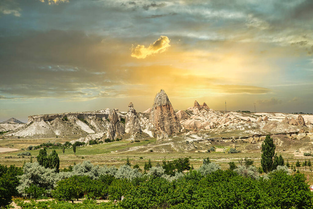 The magnificent Cappadocia valley with its rocky structure formed by volcanic tuffs. The most popular activity is to fly with balloons in the early hours. Nevsehir, Turkey - Photo, Image