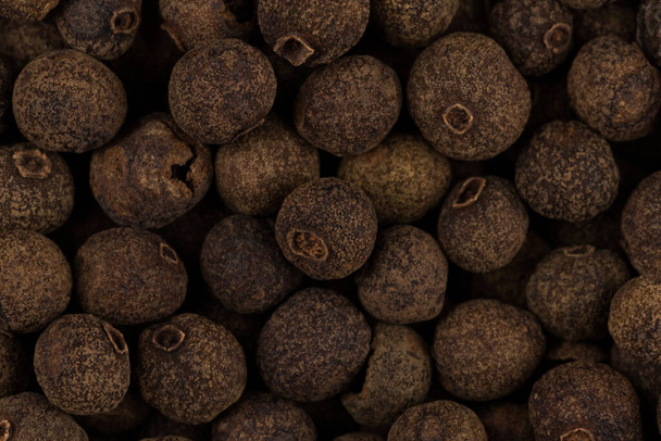 Large black pepper seeds corns as a background - Foto, Imagen
