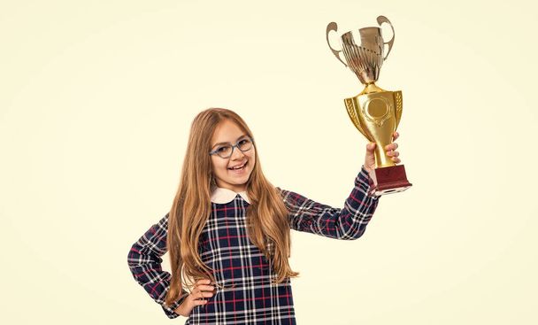 cheerful excellent school girl with award isolated on white background. excellent school girl hold award in studio. school girl winning excellent award. photo of excellent school girl with award. - Foto, immagini