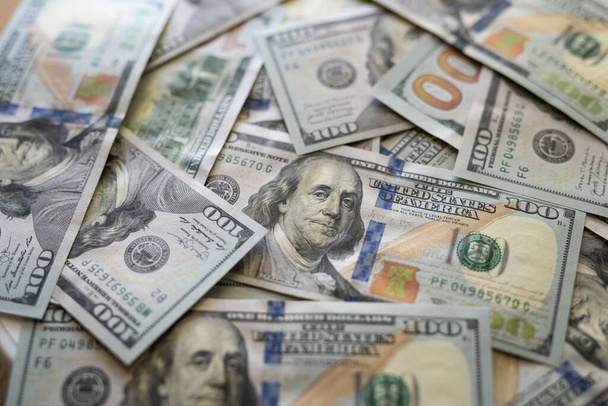 Texture of dollar bills. One hundred dollars. Close-up, macro. - Foto, afbeelding
