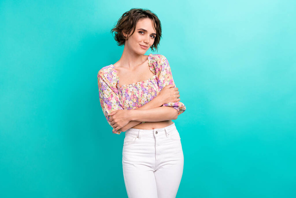 Portrait of good mood gorgeous girl with bob hairstyle dressed flower print blouse cuddle herself isolated on teal color background. - Fotoğraf, Görsel