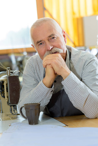 a mature man in cafe - Фото, изображение